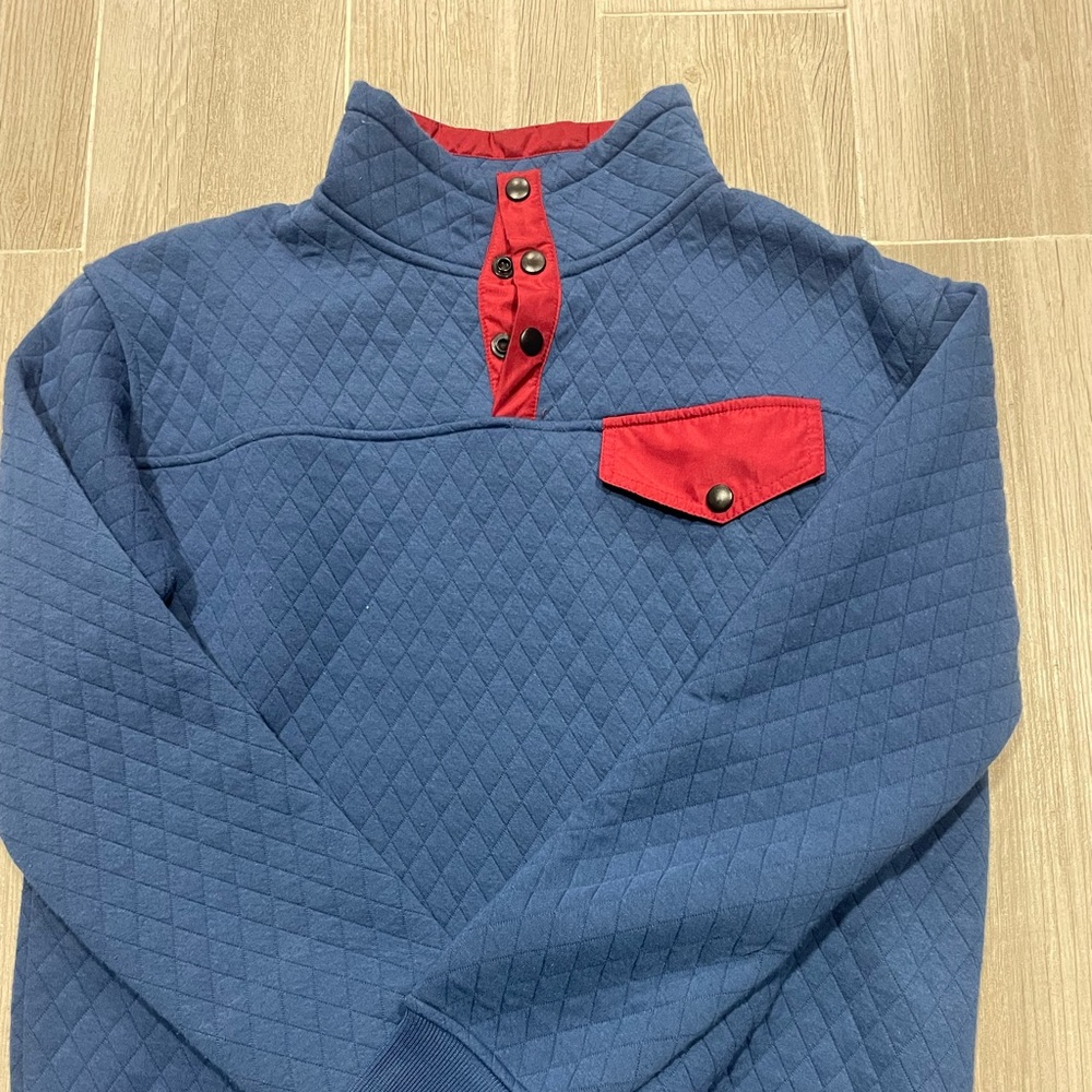 Blue quilted snap pocket sweatshirt
